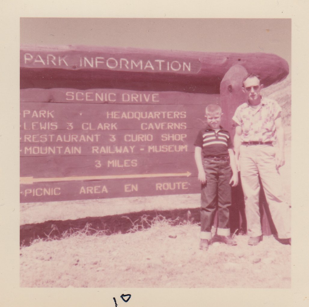 Old photo of a man and a boy at a park